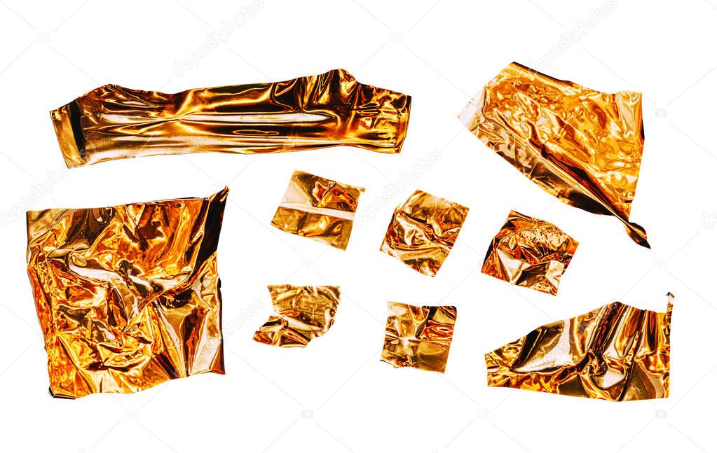 Metallic sticky tape shapes cuts isolated on white background. Shiny flexible crumpled stickers. Set for collage makers. Golden shiny metallic squares, adhesive pieces in different size.