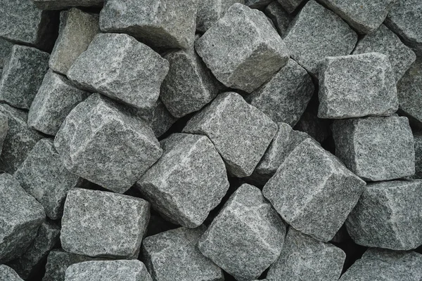Sokak kaldırımı ve arkaplan dokusu olarak granit tuğlaları kapatın