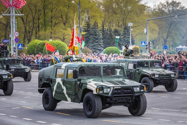 Tanks, heavy army vehicles and spectators of the celebration of the 75th anniversary of the victory in the Great Patriotic War, parade of May 9 in Minsk, Belarus. Minsk, Belarus - May 9 2020.