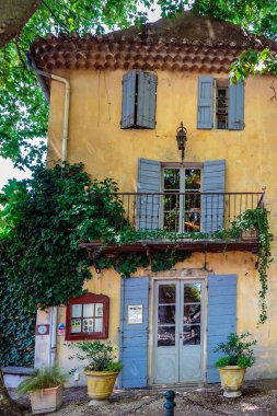La Petite Maison de Cucuron restaurant. Cucuron, France - July 28 2016. clipart