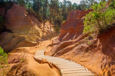 The Ochre Path le Sentier des Ocres through the Red Cliffs of Roussillon Les Ocres, a nature park in Vaucluse, Provence, France. clipart