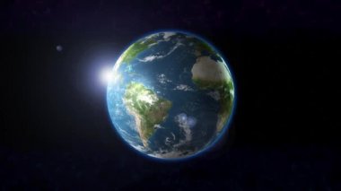 Dünya gezegeni Güneş ışığı ile uzayda