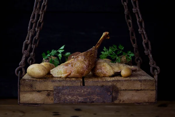 Roasted Goose Meat Served With Potatoes, Stuffing and Fresh Parsley On a Wooden Surface — Stock Photo, Image