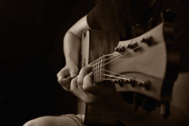 Acoustic Guitar Player Performing. Guitarist Playing In Music Studio clipart