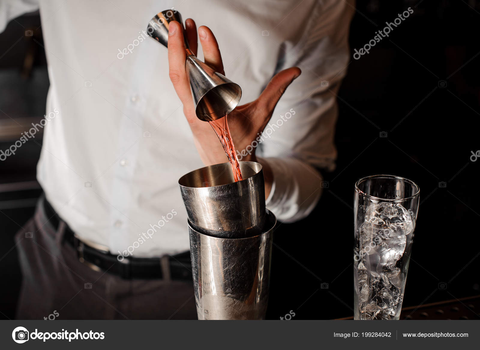 Bartender White Shirt Adding Transparent Red Alcoholic Drink Measuring Cup  Stock Photo by ©Fesenko 199284042