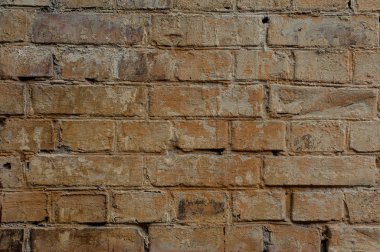 Turuncu tuğla rustik dokulu arka plan bir dikiş bir çimento ile. Dekoratif tuğla duvar arka plan