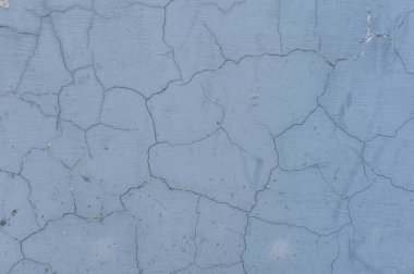 Arka plan doku uzun zaman önce uzun çatlaklar ile mavi çimento duvara boyalı