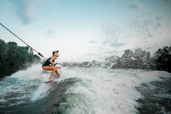 Young Active Brunette Woman Riding Wakesurf Holding Rope Motorboat Background — Stock Photo, Image