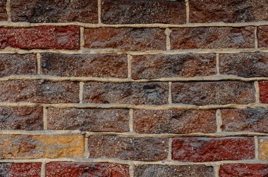 Dış duvar makro fotoğraf beton dikdörtgen çok renkli yeni tuğlalar arasında çizgilerle