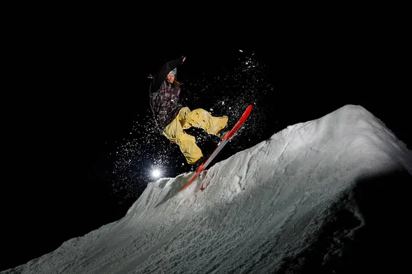 Freeride Snowboarder Dreadlocks Dressed Yellow Sportswear Jumping Mountains Night — Stock Photo, Image