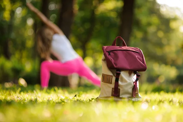 Backpack Grass Green Park Summer Day Background Woman Doing Yoga — Stock Photo, Image