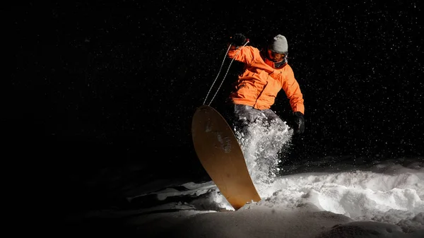 Active Sportsman Snowboarder Dressed Orange Sportswear Mask Jumping Snowy Hill — Stock Photo, Image