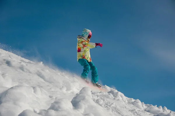 Woman Snowboarder Bright Sportswear Riding Mountain Slope Bright Blue Sky — Stock Photo, Image