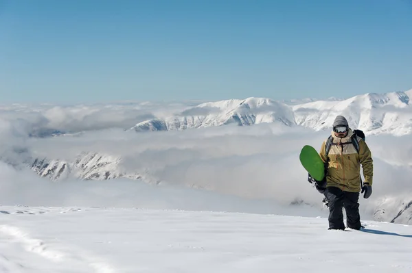 Manful Snowboarder Walking Snowboard Popular Tourist Resort Georgia Background Mountains — Stock Photo, Image