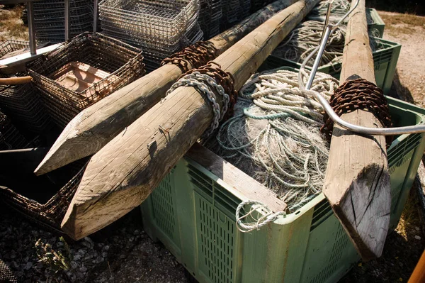 Wooden stakes with ropes on the plastic box