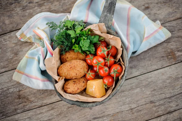 View from above on the tasty traditional georgian dish Mchadi in the pot on a light striped tablecloth — Stock Photo, Image