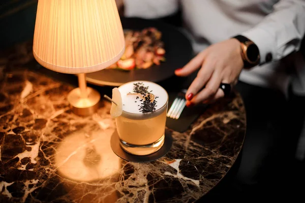 Delicious cocktail decorated with a chia seeds on the table — Stock Photo, Image