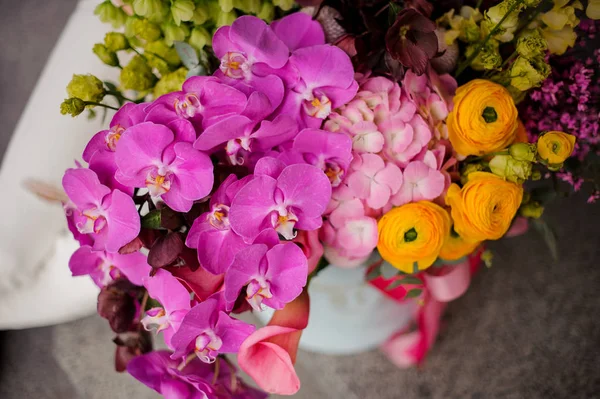 Rich bouquet in hat box on a ground