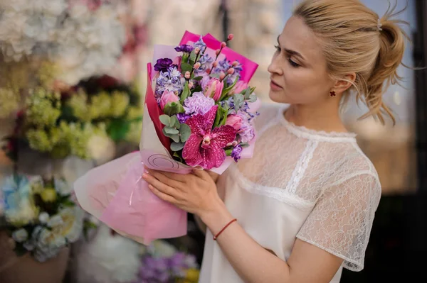 Stock image Girl with very cute bouquet in pink paper