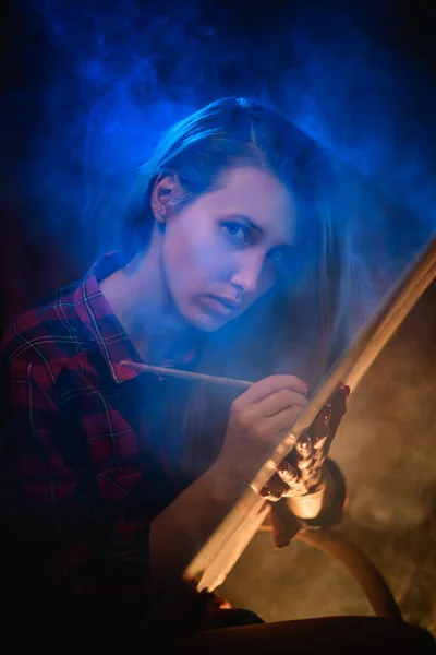 Portrait of young beautiful woman with long hair who paints — Stock Photo, Image