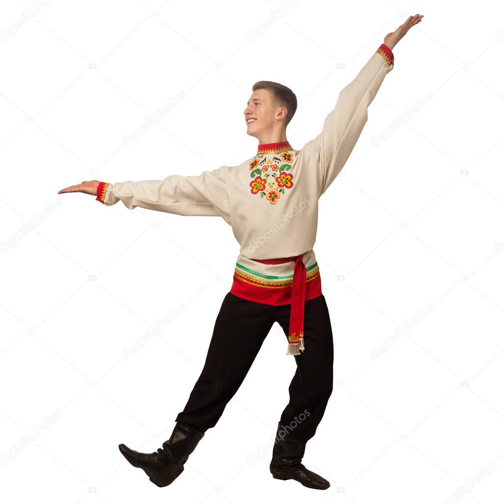 Attractive russian guy dancing in folk costume isolated on white background