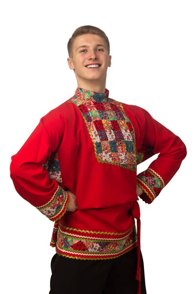 Attractive russian guy dancing in folk costume isolated on white background