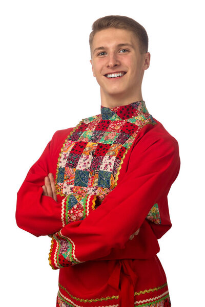 Portrait of the attractive russian guy in red folk costume isolated on white background