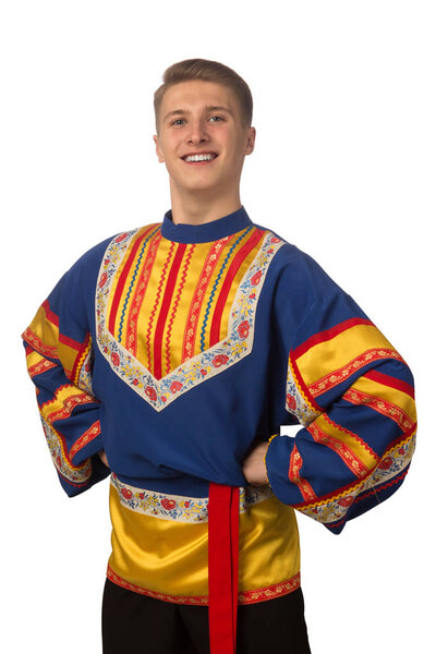 Attractive russian guy dancing in folk costume isolated on white background