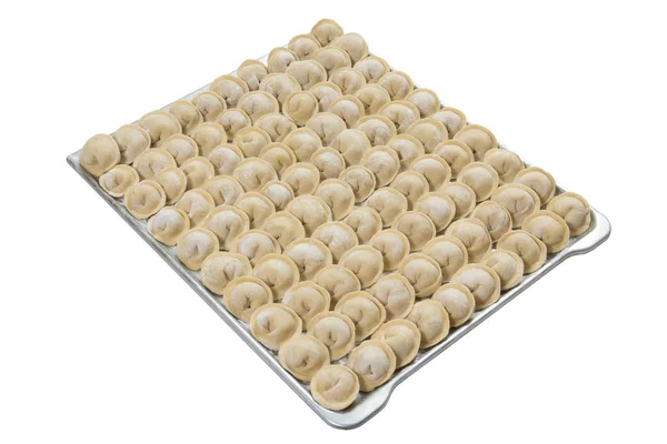Uncooked homemade Russian dumplings on a tray isolated on white — Stock Photo, Image