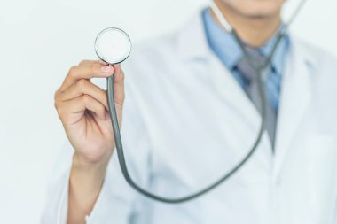 Health care and medical services concept. Close up of Medical doctor with a stethoscope in the hands.