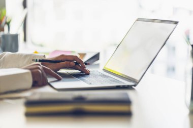 Close up of business woman working with notebook computor in the office. freelancer working online in the coffee shop.