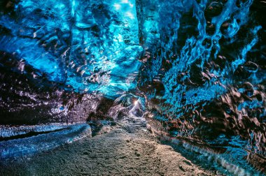 Ice cave inside glacier in Iceland. clipart