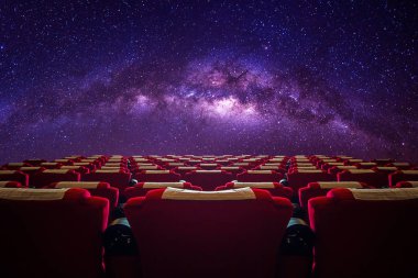 Cinema hall with red seat in Milky way galaxy. clipart