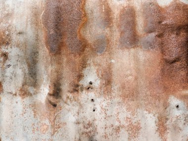 Pas tutmuş metal bir levhanın fotoğrafı, tasarım için doku veya doku olarak kullanılacak.