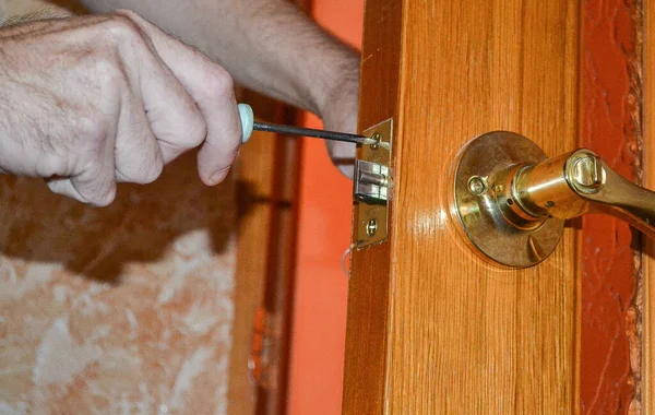 repair of the door lock on the yellow door.
