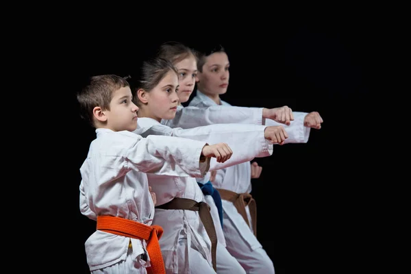 Los Niños Están Entrenando Karate Sobre Fondo Negro — Foto de Stock