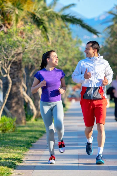 Young Smiling Sporty Man Woman Sportswear Jogging Palm Trees — Stock Photo, Image