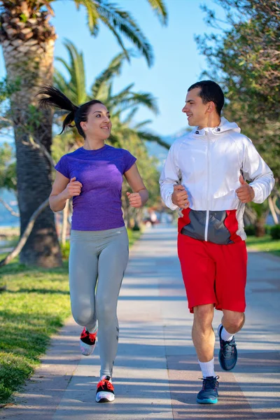 Young Smiling Sporty Man Woman Sportswear Jogging Palm Trees — Stock Photo, Image