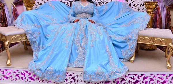 Moroccan caftan in blue. Dressed by the Moroccan bride on her wedding day. Moroccan caftan is one of the most famous traditional clothing in the world