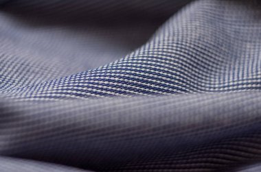 Mavi kumaş tekstil malzemesi, doku makrosu, bulanık arkaplan