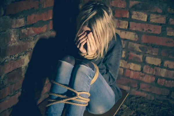 Blonde Girl Bound Hands Feet Sitting Basement Covering Her Face — Stock Photo, Image