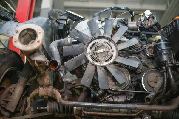 Close-up of a car engine with fan blades on the car. Concept of repair, auto Assembly