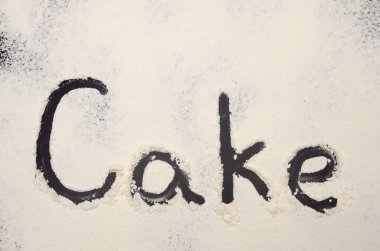 Kelime Keki un ile birlikte siyah bir arkaplanda yazılır. Yazı.