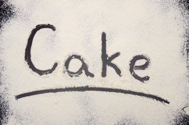 Kelime Keki un ile birlikte siyah bir arkaplanda yazılır. Yazı.