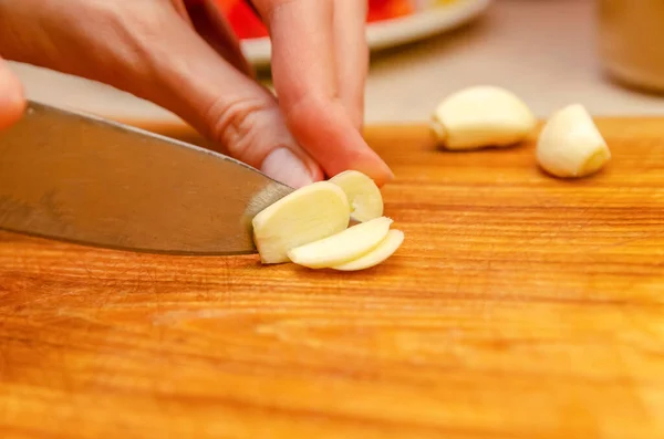 Woman Chopping Garlic Knife Wooden Plank Closeup — Stock Photo, Image