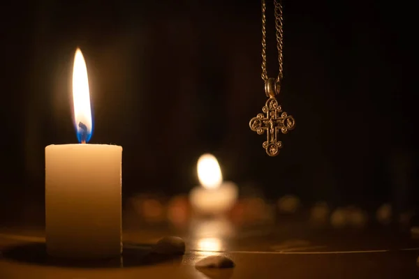 Composition Large Burning White Candle Orthodox Cross Background Blurred Background — Stock Photo, Image