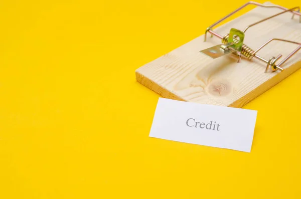 Mousetrap Piece Paper Inscription Credit Yellow Background Copy Space Concept — Stock Photo, Image