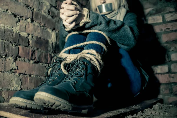 Girl Her Hands Feet Tied Her Mouth Taped Sitting Basement — Stock Photo, Image