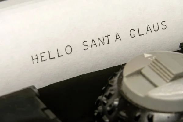 Close up printed text Hallo Santa Claus on an old typewriter