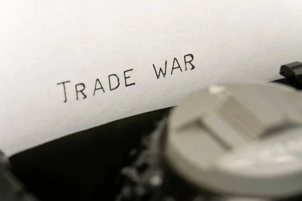 Close up printed text Trade war on an old typewriter